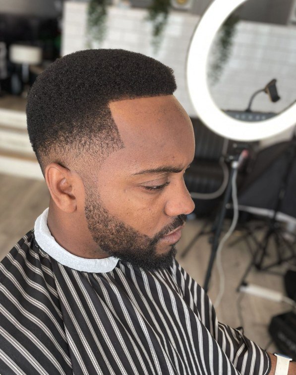 Afro haircut and beard finish by Swarv Studio