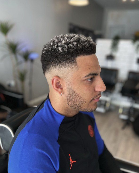 Curly top skin fade by Swarv Studio